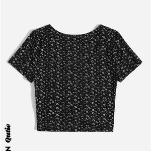 a black shirt with flowers from shein! good condition barely worn